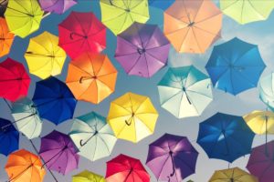 A sky full of opened umbrellas in different colours