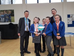 A photo of pupils from Castle Hill primary school holding the Kent Award alongside Councillor Rory Love.
