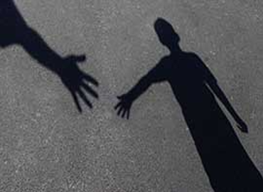 image of shadows reaching out to hold hands