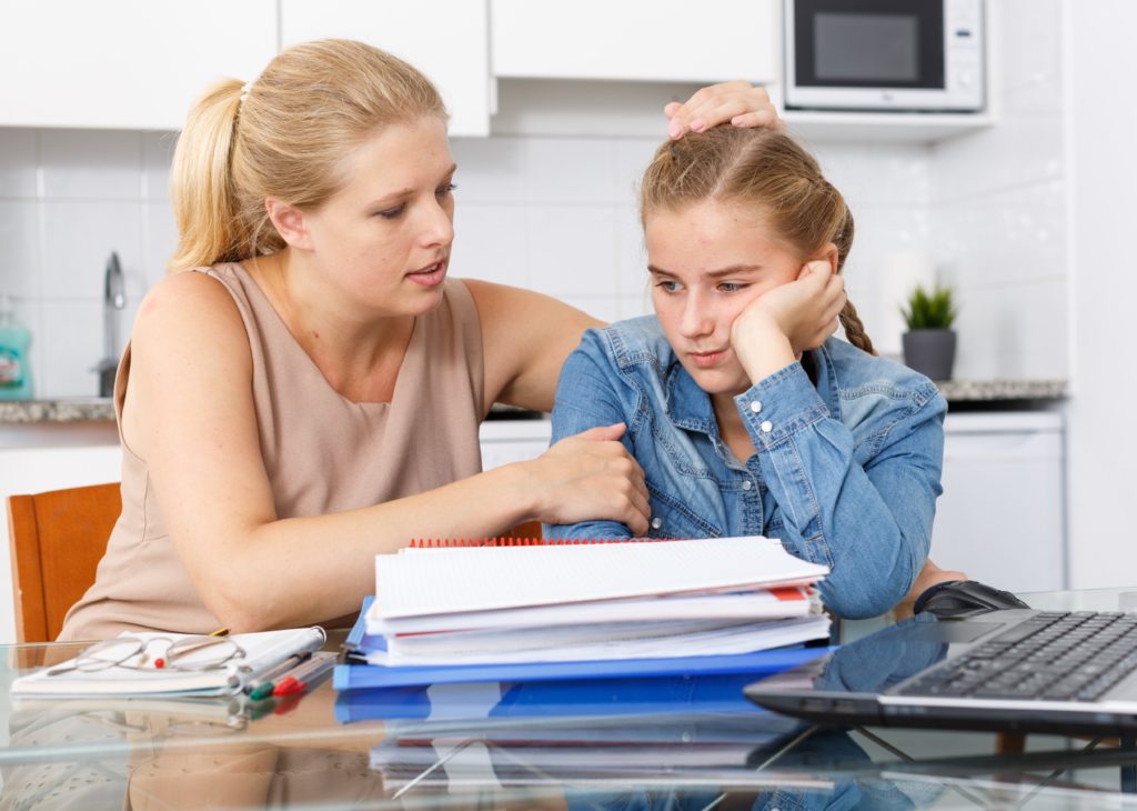 parent helping frustrated teenager make choices