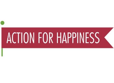 Maroon flag with Action for happiness written inside