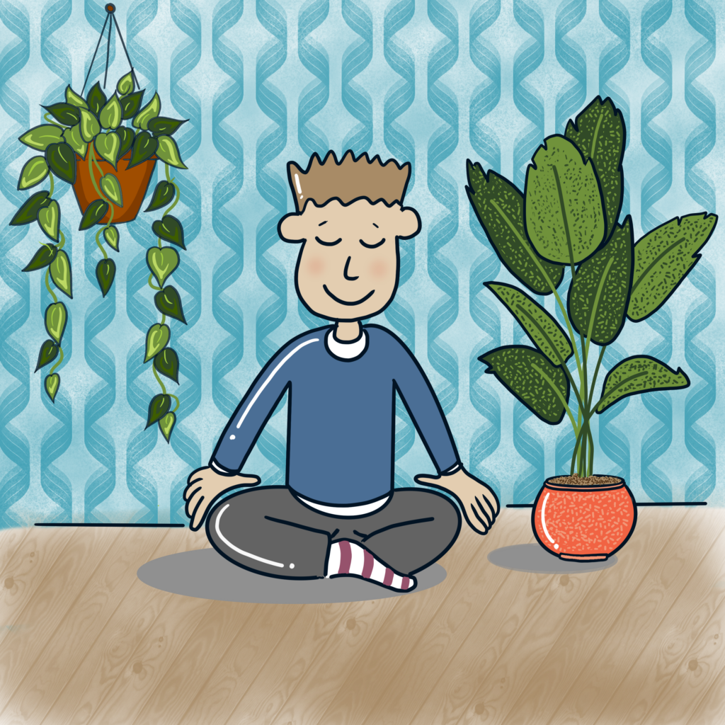 boy seated eyes closed, cross legged on the floor next to a plant