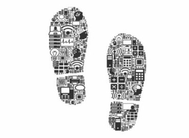 A black and white graphic of two footprints, and within the print itself are patterns of images of computers, phones, calculators, laptops, human heads with digital circuits, wifi signs and lightbulbs.