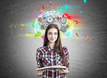 Girl holding book with coloured thoughts around head